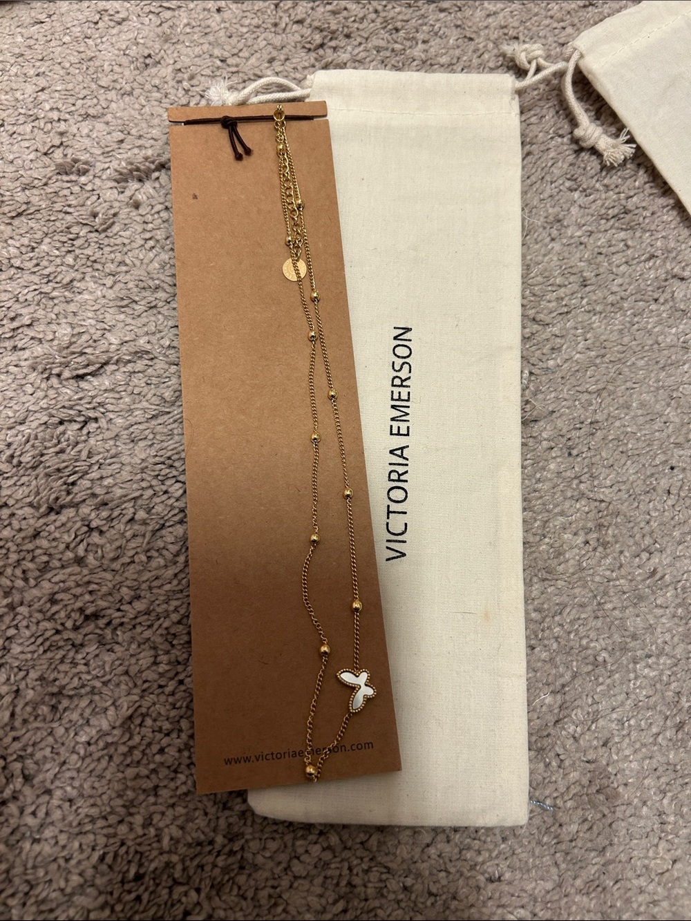 Victoria Emerson Gold Layered Necklace with White Butterfly Charm